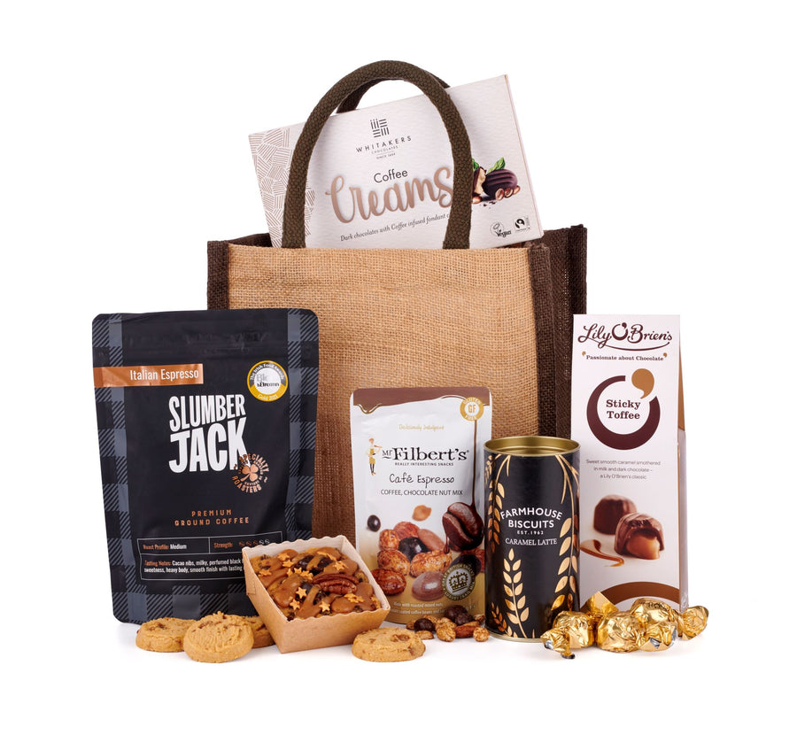 The Coffee Break Hamper Bag featuring coffee based treats, including caramel latte farmhouse biscuits, sticky toffee treats from Lily O'Brien's, Mr Filberts cafe espresso chocolate nut mix, & of course Slumber Jack premium bound coffee. All packed into the reusable pictured hessian gift bag. 